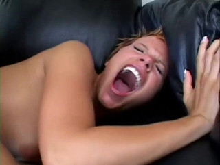 Short haired ginger slut proves with her ass on the black sofa