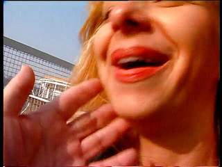 Blonde and redhead babe giving an outdoor interview