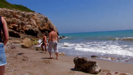 She enjoys two cocks at the sea fucking all her holes