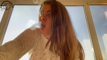 Latina Smoking at Sunset