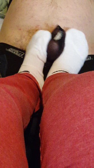 Stomping his cock with my white socks