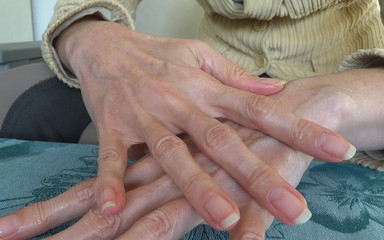 Creaming hands. Close-ups. Natural fingernails in classic length
