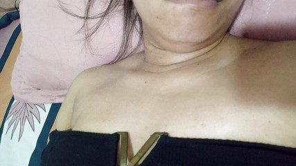 Young Girl Is Clearly Seen Her Big and Hard Tits, She Touches Them with Her Tongue and She Chews Rich on Her Bed