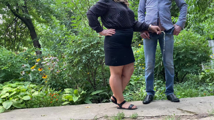 Stepmom holds stepson's cock while he pisses outside