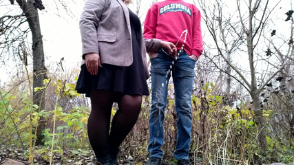 Mother-in-law in a short dress holds son-in-law's cock and excites him