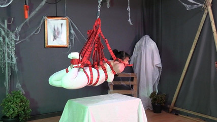 Belt Suspension and a White Catsuit