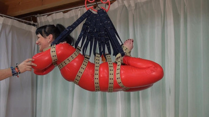 Belt suspension and a red catsuit - Yvette Costeau in action