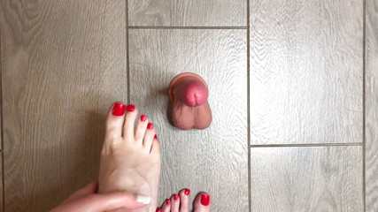 Sexy red nailed feet play with a dildo