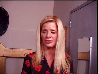 Sexy blonde in nylons getting ready for a BDSM session