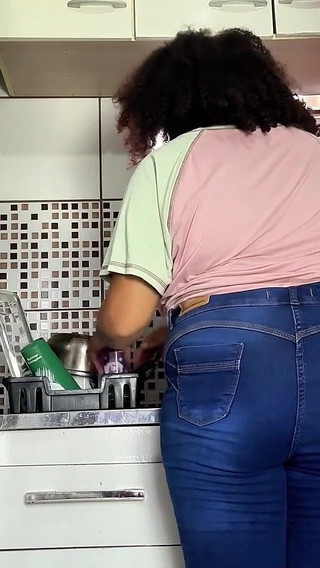 Curvy Girl Farting in Jeans While Doing the Dishes