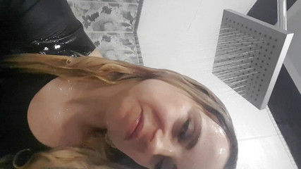 I'm wet in a latex bathing suit and I am taking a shower