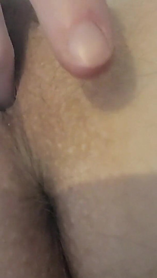 Up Close Playing with Her Holes