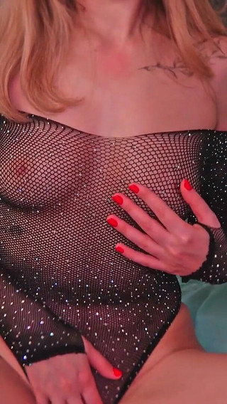 A Beauty with Cute Tits and in Beautiful Lingerie Watches Porn and Caresses Herself